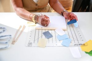 Woman making notes to reframe insecurities